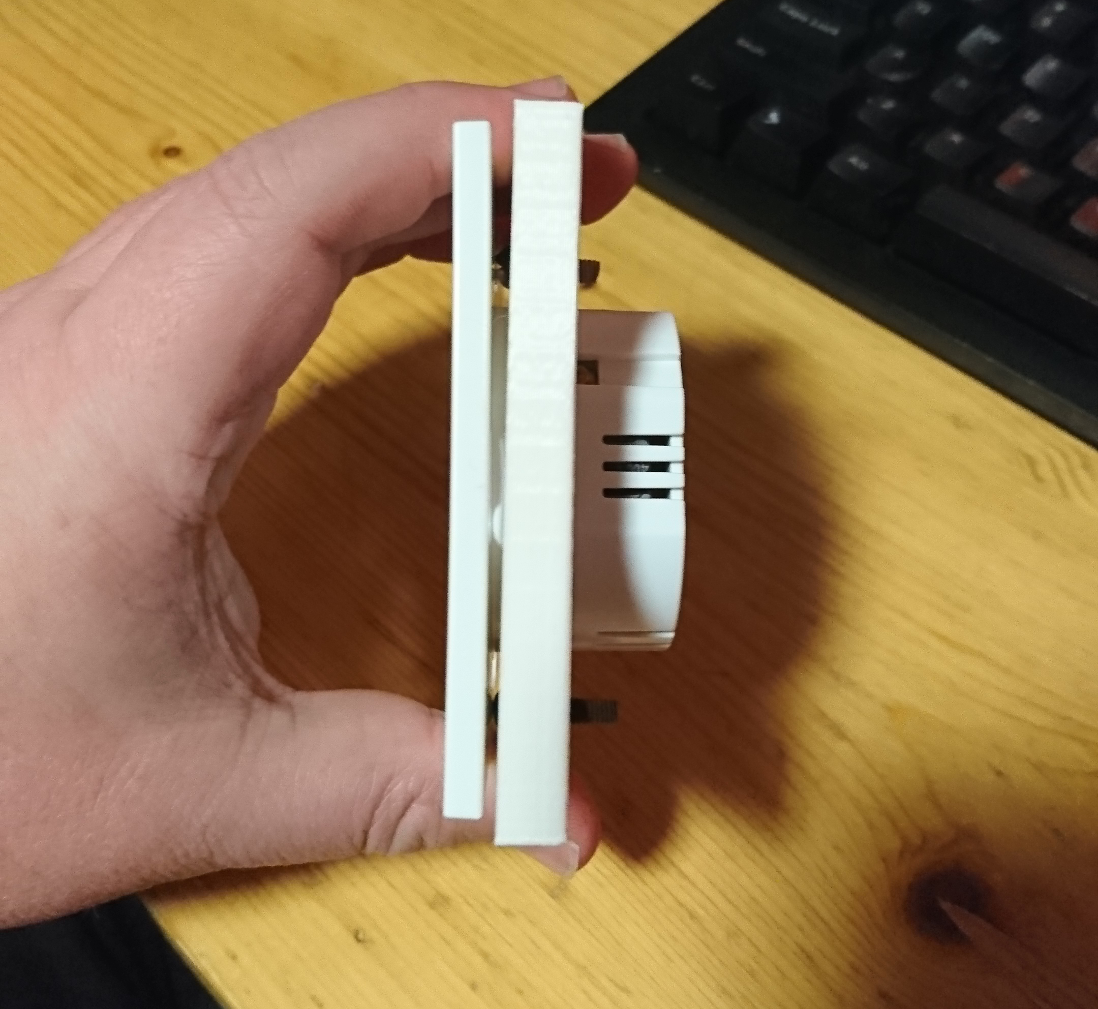Photo showing the 3D printed part not fitting correctly due to measurement error.